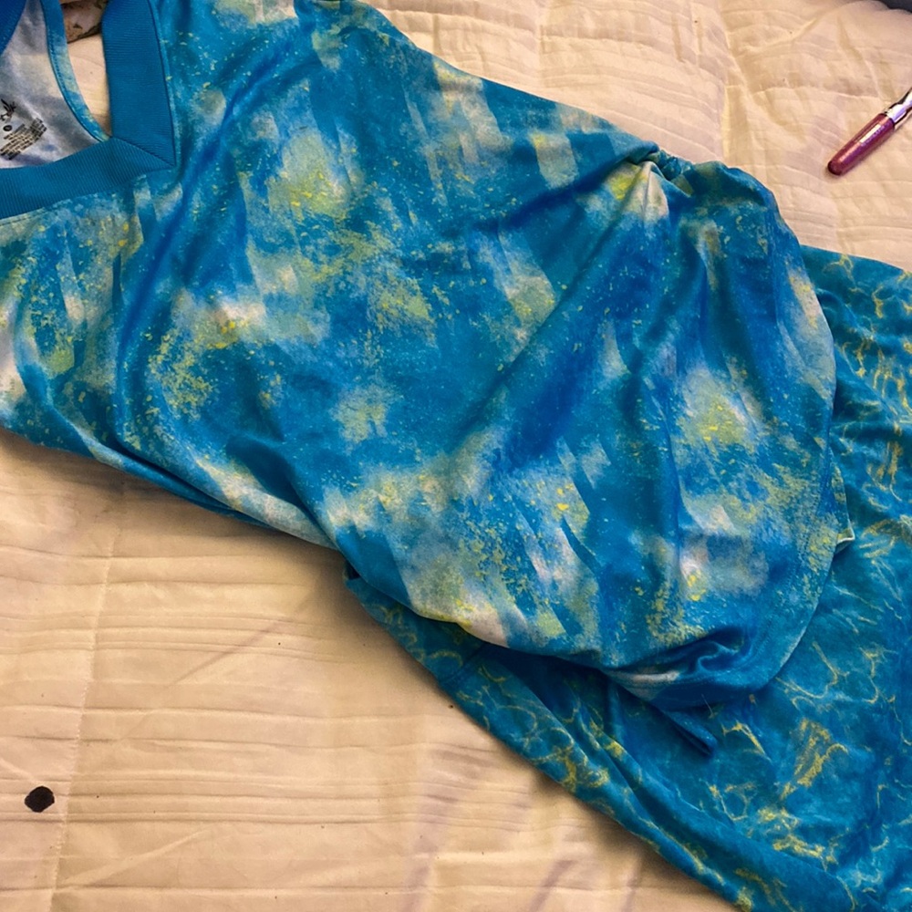 Size small .Comfortable biker shorts underneath comfortable skirt-matching top.